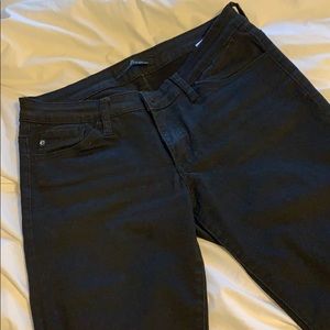 Black Kancan jeans with rips in both knees